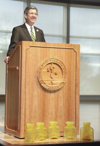 WVSOM President James Nemitz, Ph.D., stands behind a lectern in the WVSOM Student Center.