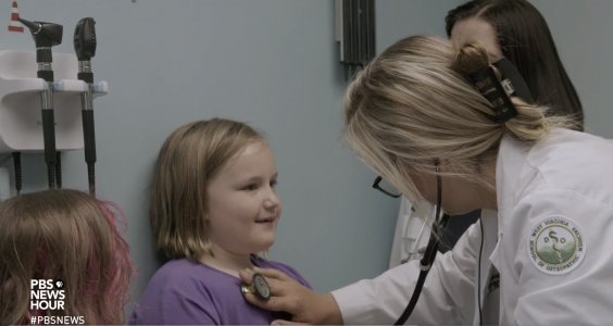 A WVSOM student sees a patient in a still image from PBS NewsHour