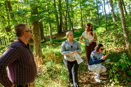 Matthew Williams, Ph.D., and students gathering samples