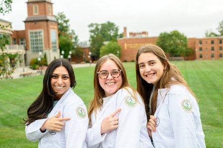 Students wearing white coats