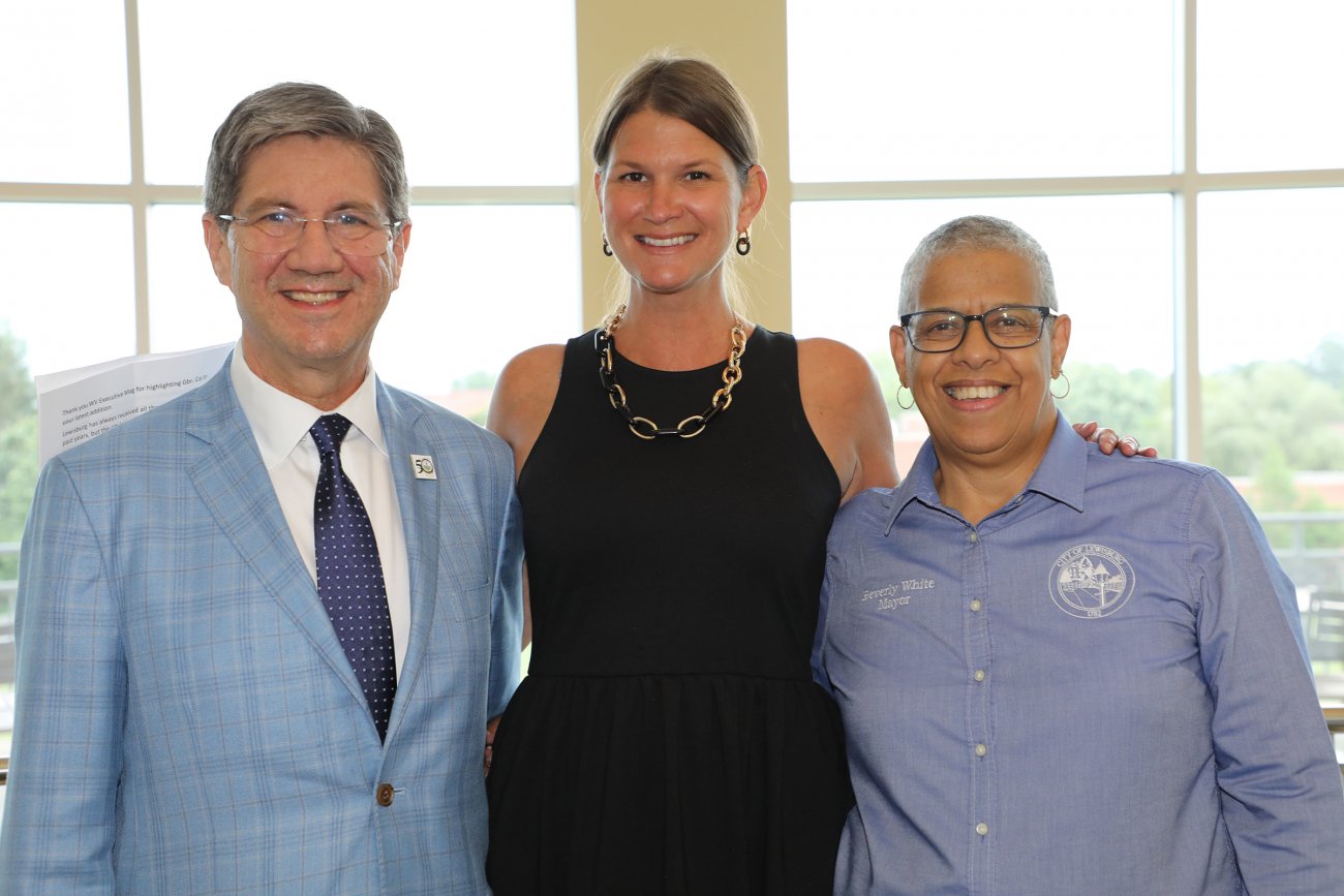 WVSOM President James W. Nemitz, Ph.D., Greater Greenbrier Chamber of Commerce Executive Director Ashley Vickers, and Lewisburg Mayor Beverly White pose during a reception in the WVSOM Student Center.