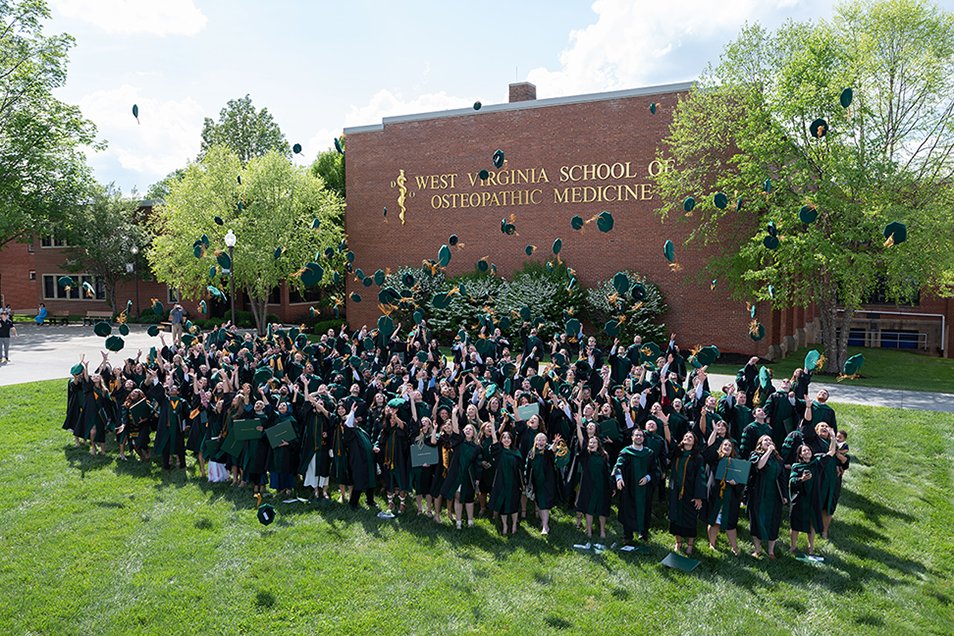 WVSOM's Class of 2025 tossing hats in the air