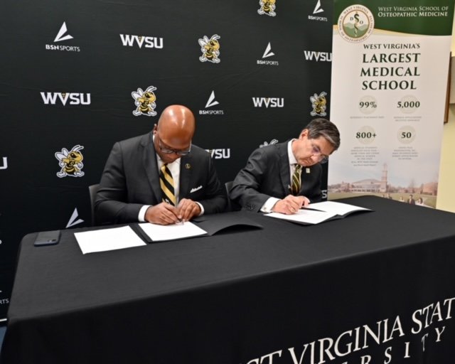 WVSU President Ericke S. Cage and WVSOM President James W. Nemitz, Ph.D., sign a memorandum of understanding 