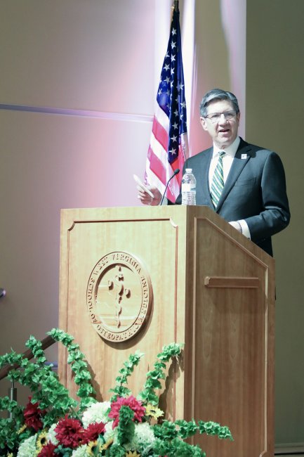 WVSOM President James W. Nemitz, Ph.D., speaking behind a lectern